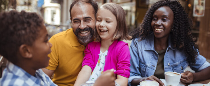 Close up of a young family enjoying time together in a cafe