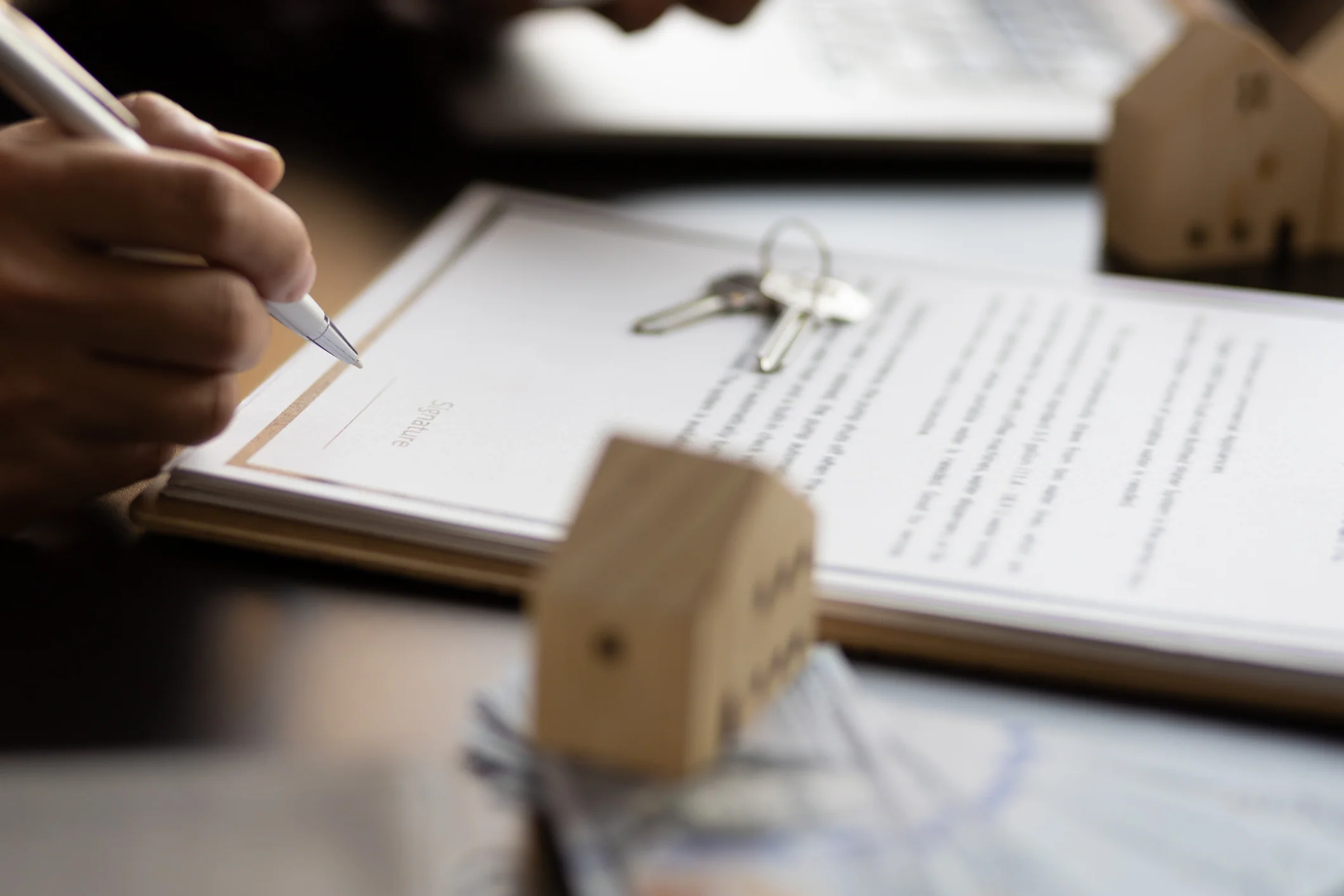 Businessman signing a contract for a purchase agreement mortgage and rental housing.
