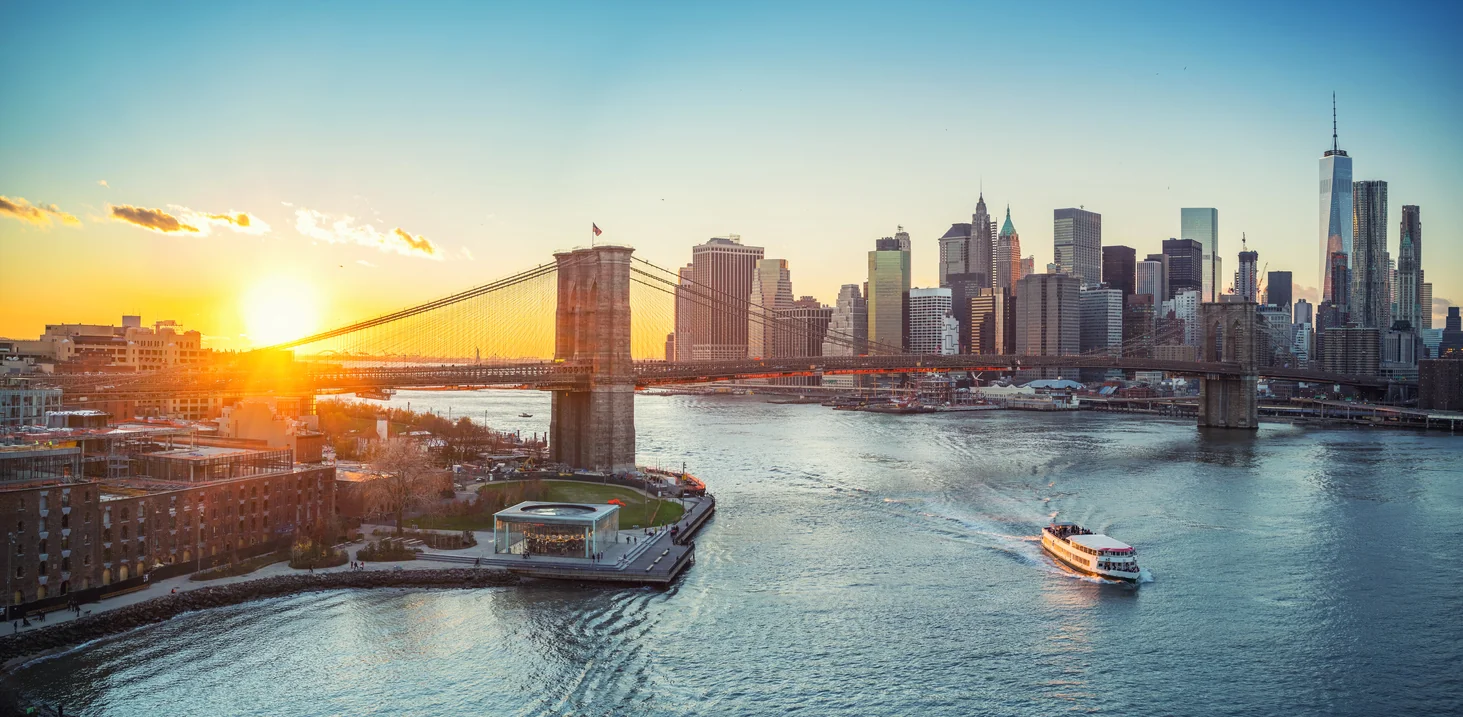 Panoramic view of Brooklyn bridge and Manhattan at sunset, New York City